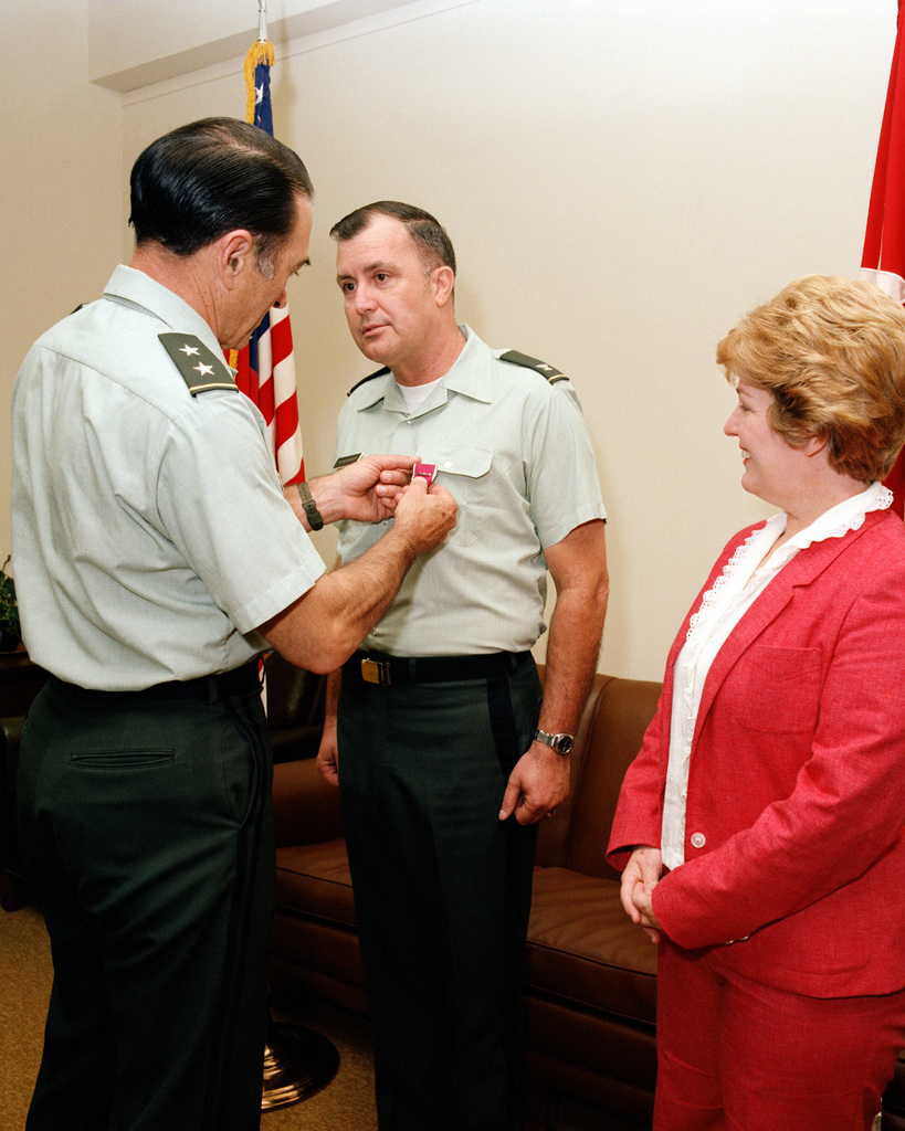 The Legion of Merit with Third Oak Leaf Cluster was presented to COL  Charles B. Eichelberger, by MGEN Louis C. Menetrey, director of  Requirements, Officer of the Deputy CHIEF of STAFF Operations.