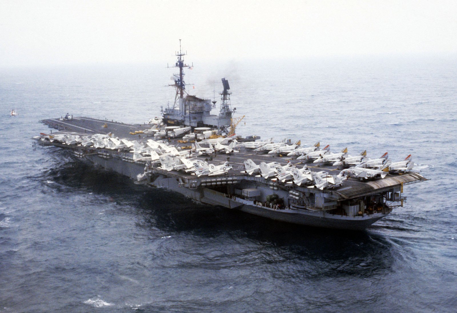 A port quarter view of the aircraft carrier USS MIDWAY (CV 41) underway ...