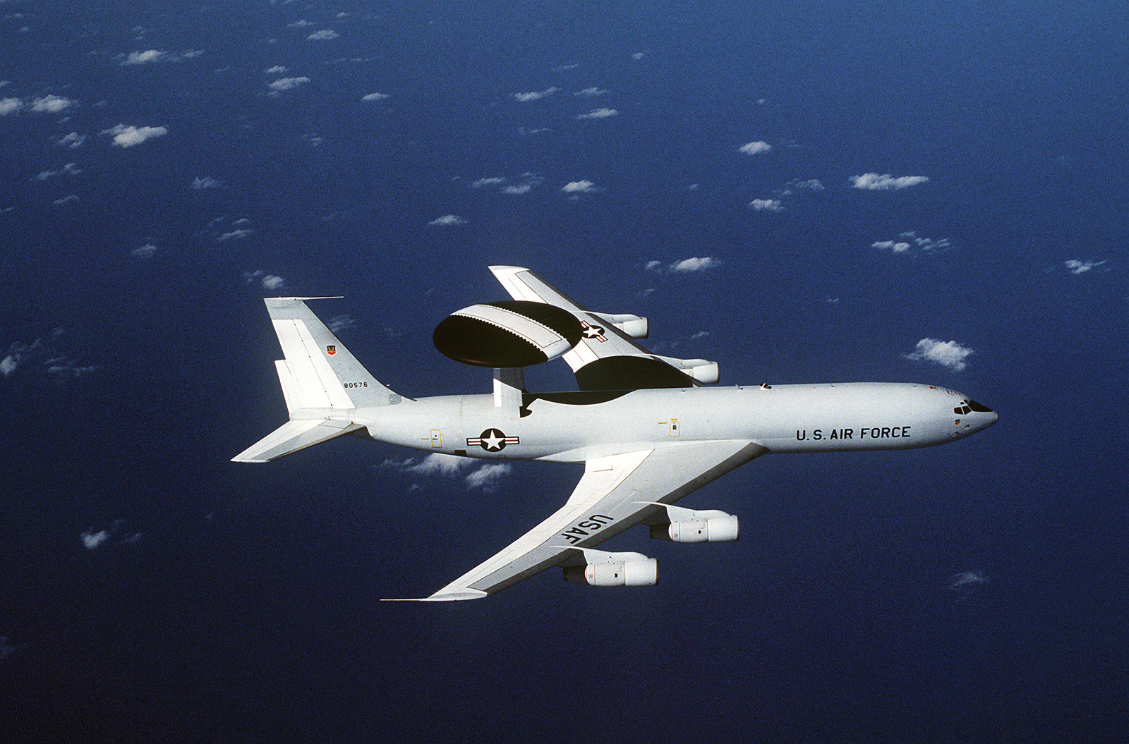 An air-to-air right side view of an E-3A Sentry Airborne Warning and ...