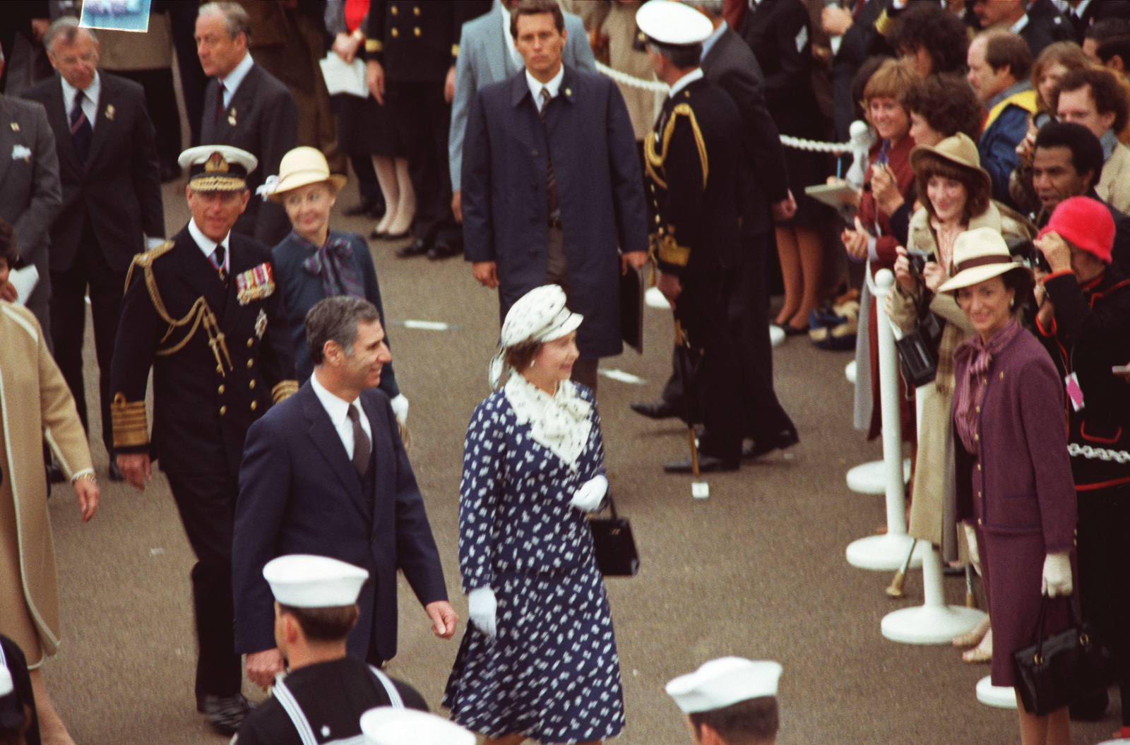 Queen Elizabeth II and Prince Philip walk along the Broadway Pier after ...