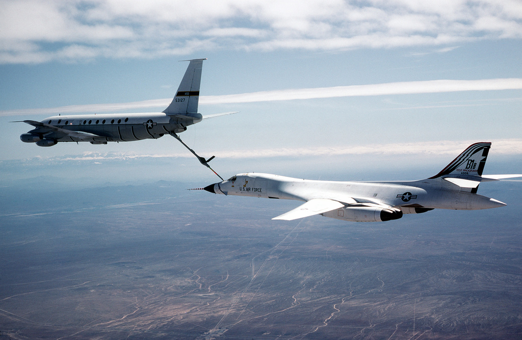 An Air-to-air Left Rear View Of A B-1B Bomber Being Refueled By A KC ...