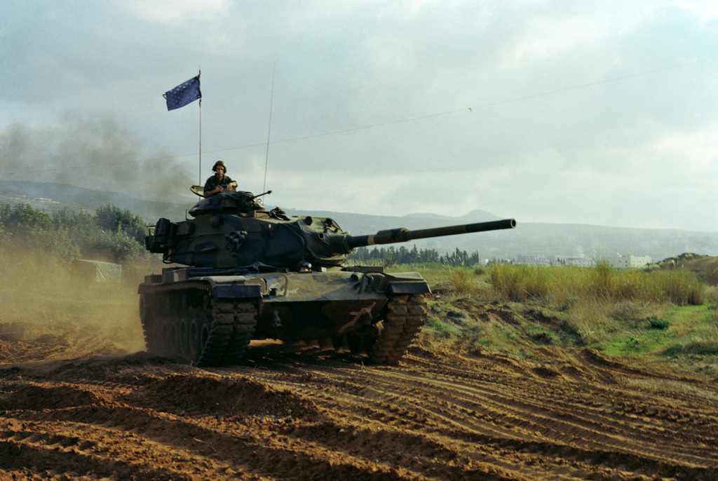 An M60 main battle tank monitors a US Marine Corps encampment on the ...