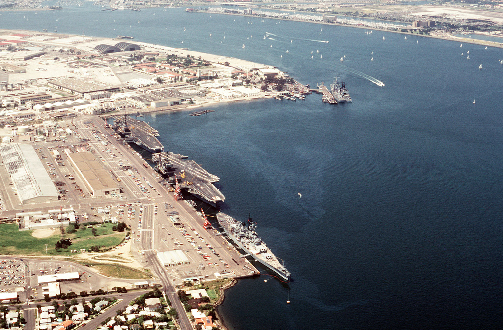 Aerial view of US Navy ships docked at the naval station. They are ...