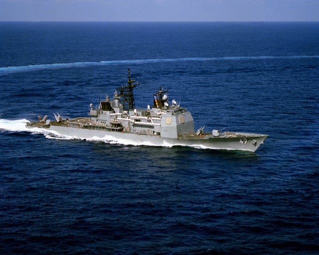 An aerial starboard bow view of the Aegis guided missile cruiser USS ...