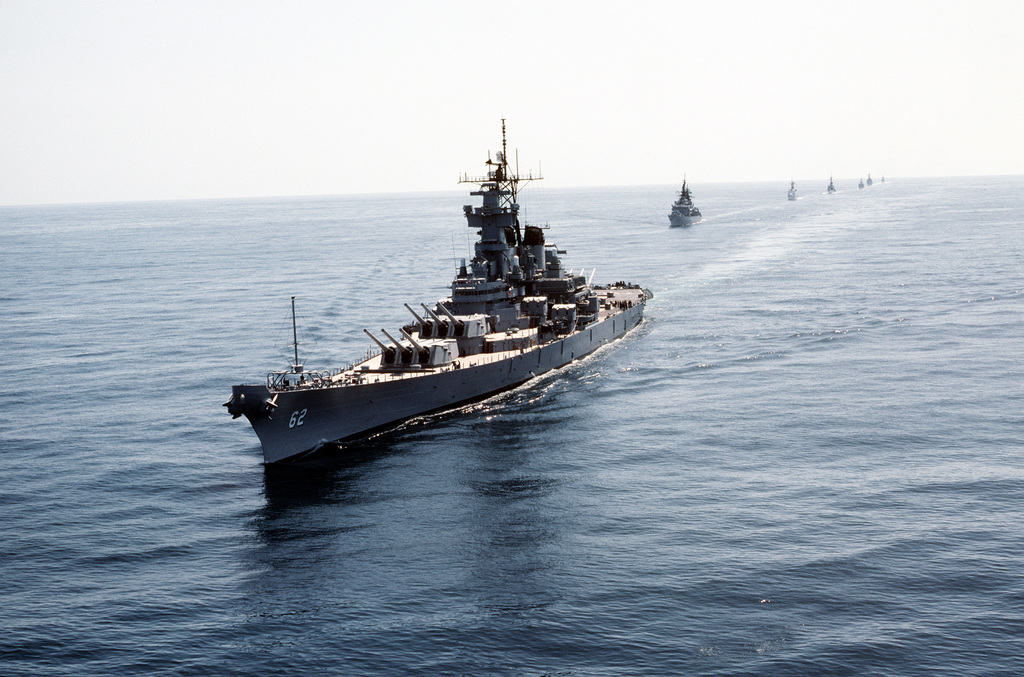 An aerial port bow view of the battleship USS NEW JERSEY (BB-62