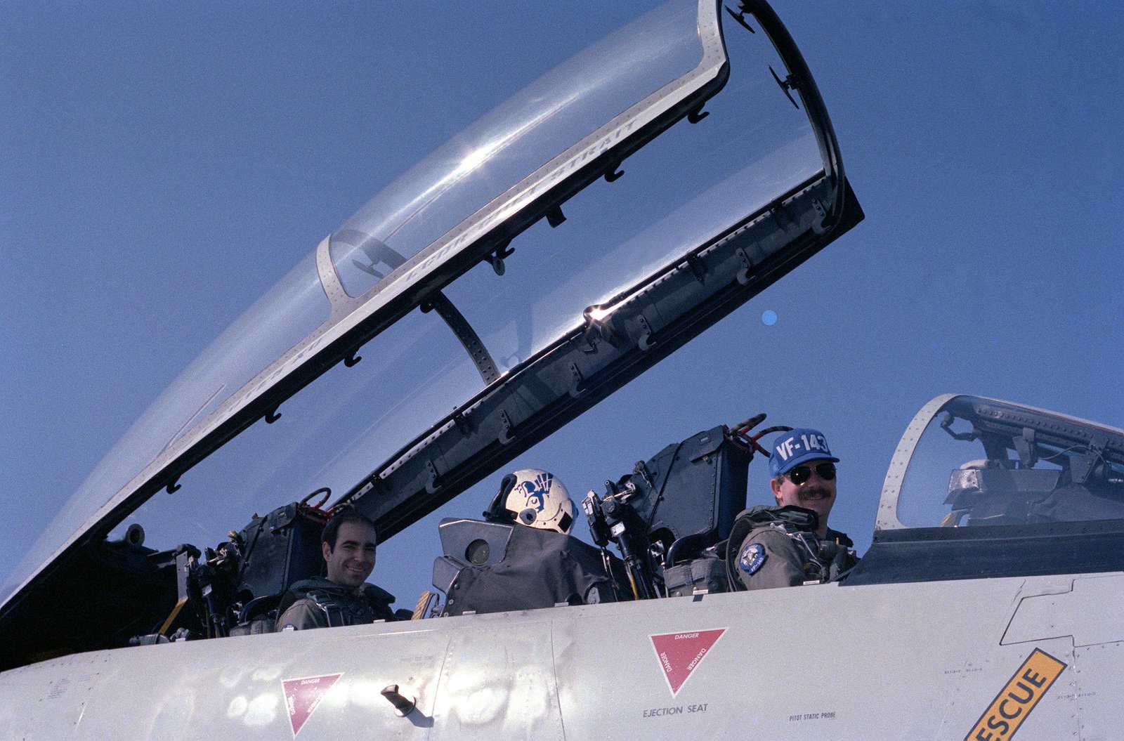 A Pilot And Radar Intercept Officer From Fighter Squadron 143 Vf 143 Sit In The Cockpit