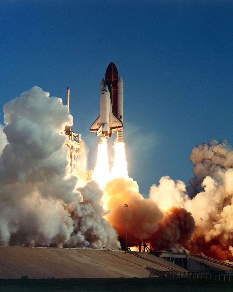 The space shuttle orbiter Challenger lifts off from Complex 39A at 7:33 ...