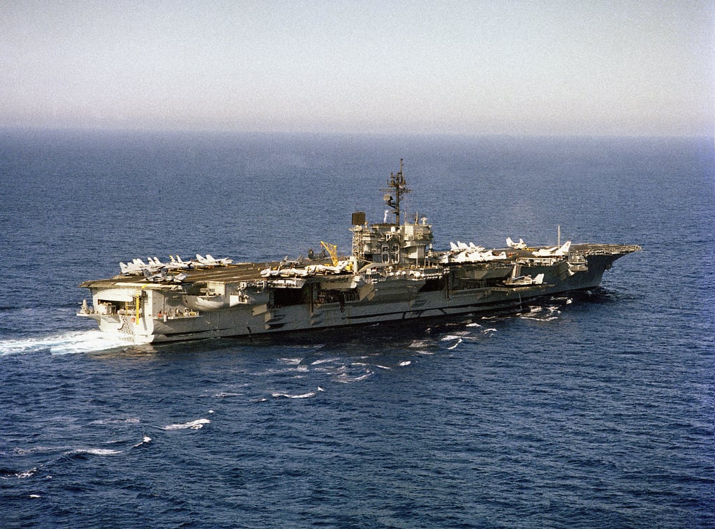 An aerial starboard quarter view of the aircraft carrier USS KITTY HAWK ...