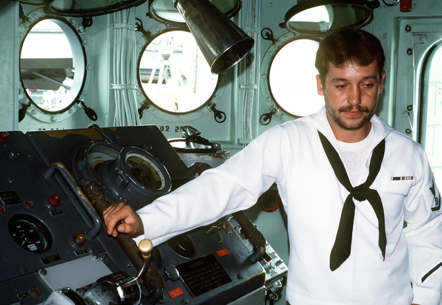 US Navy Engineman 2nd Class Anthony Bartelli (right) holds an