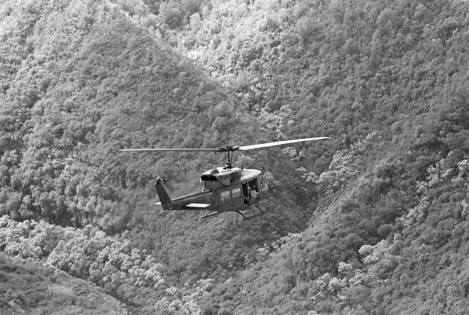 an-air-to-air-right-rear-view-of-a-uh-1-iroquois-helicopter-from-marine