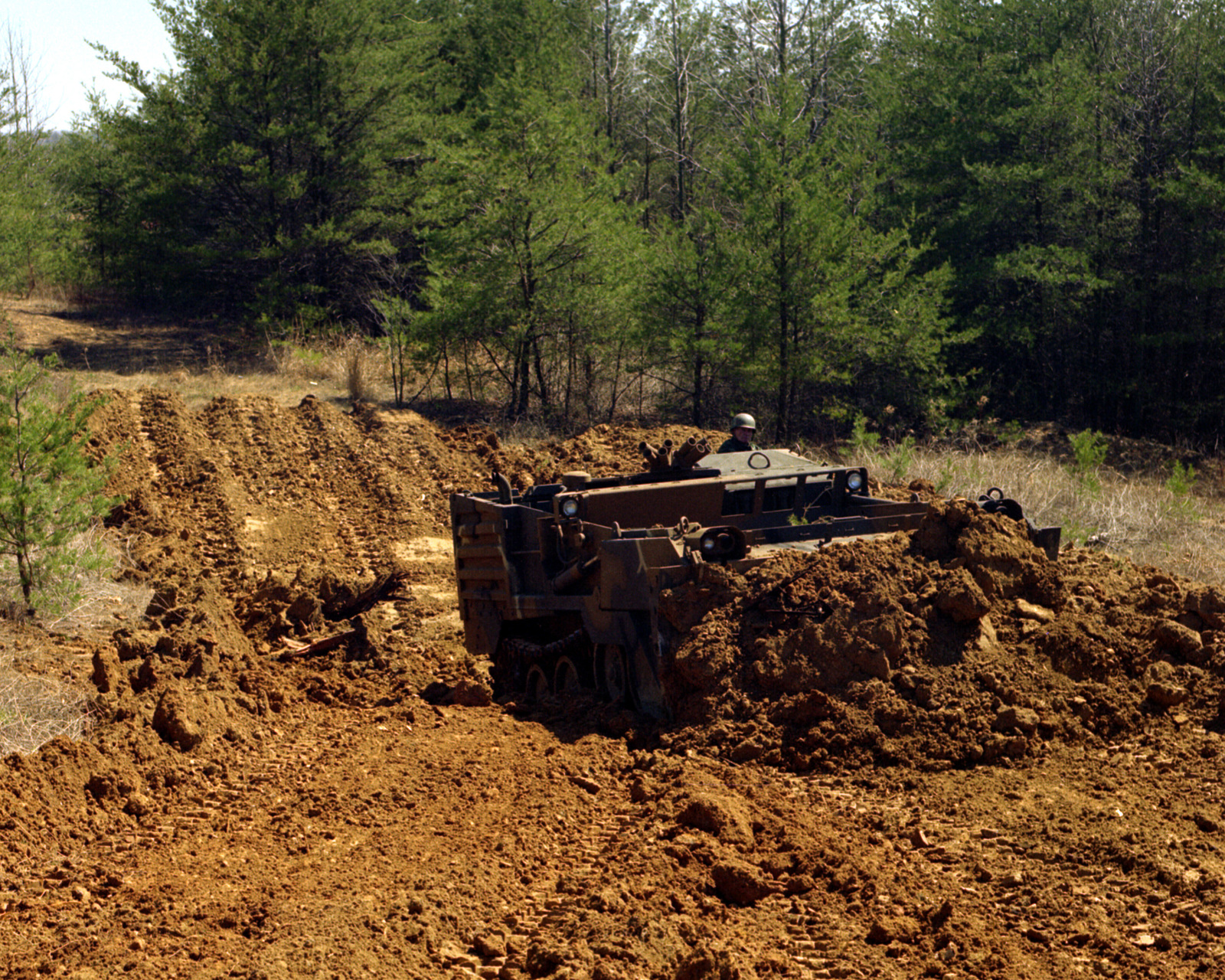 a-right-front-view-of-an-m-9-armored-combat-earthmover-ace-digging-a