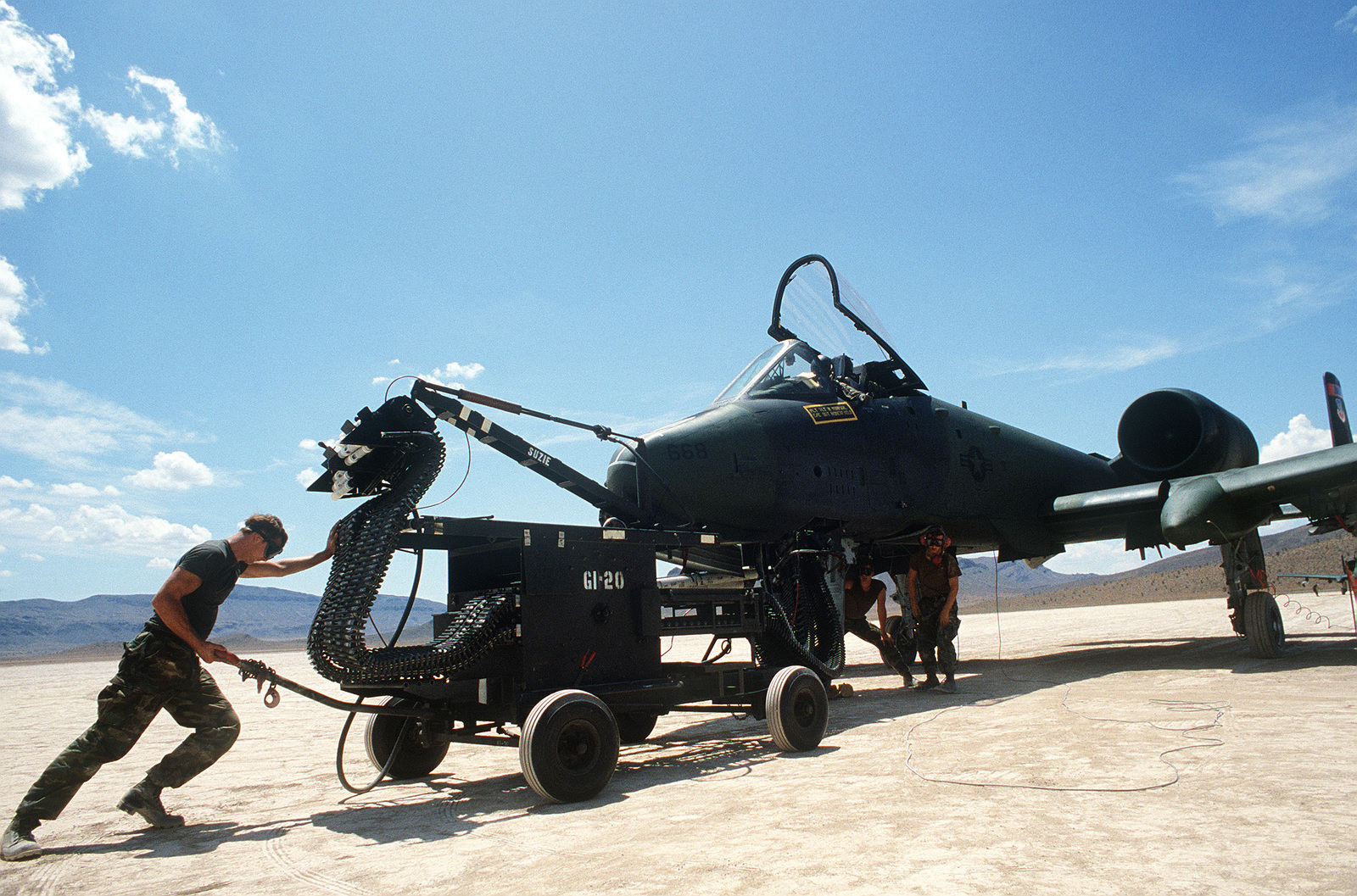 A 30 mm cannon loader is moved into position for rearming of an A-10 ...