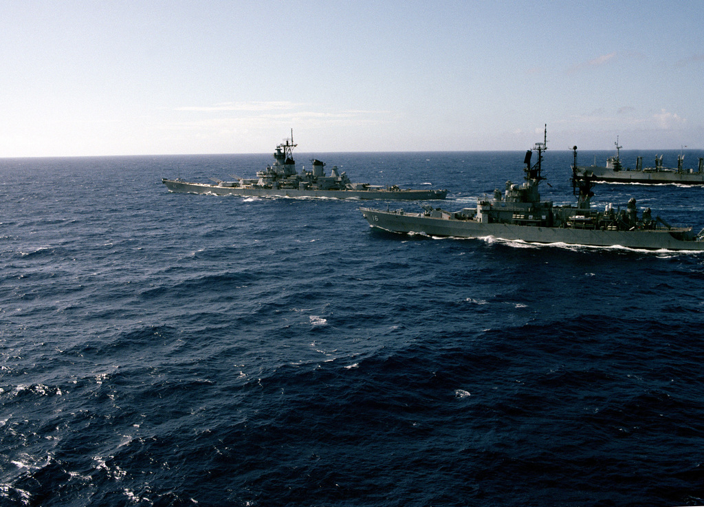 An aerial port view of the battleship USS NEW JERSEY (BB 62) underway ...