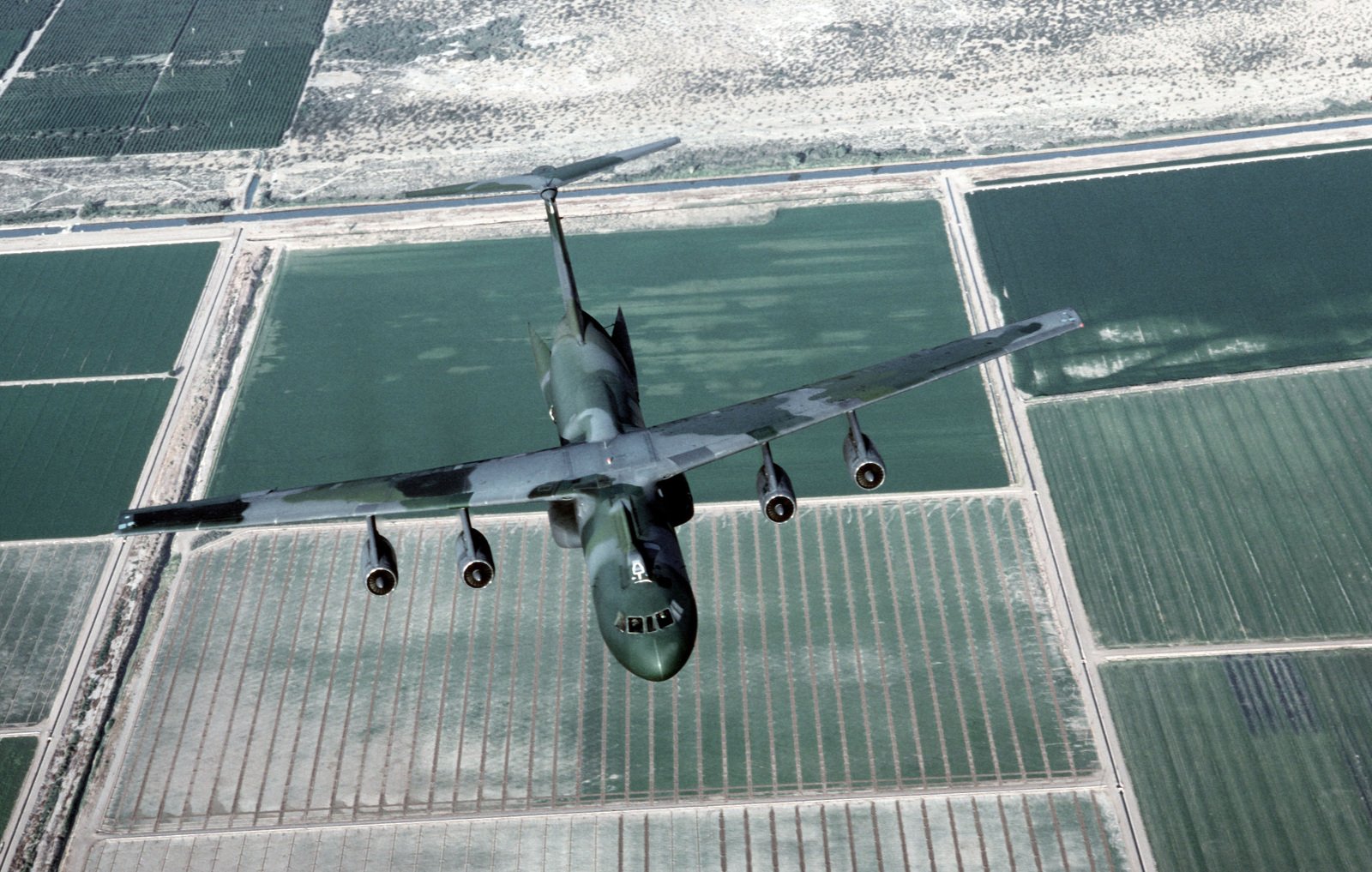 An Air-to-air Overhead Front View Of A C-141B Starlifter Aircraft, With ...