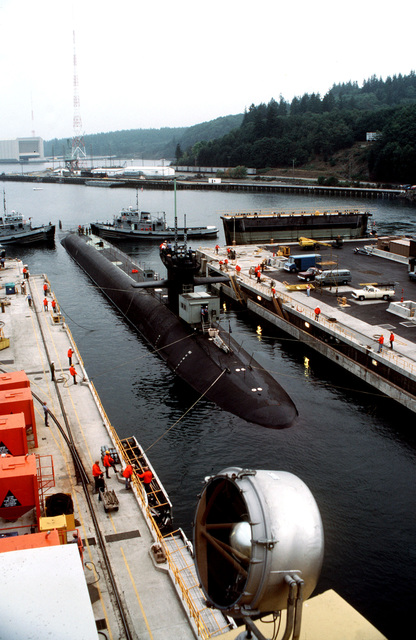 YTB 760-class harbor tugs guide the nuclear-powered strategic missile ...