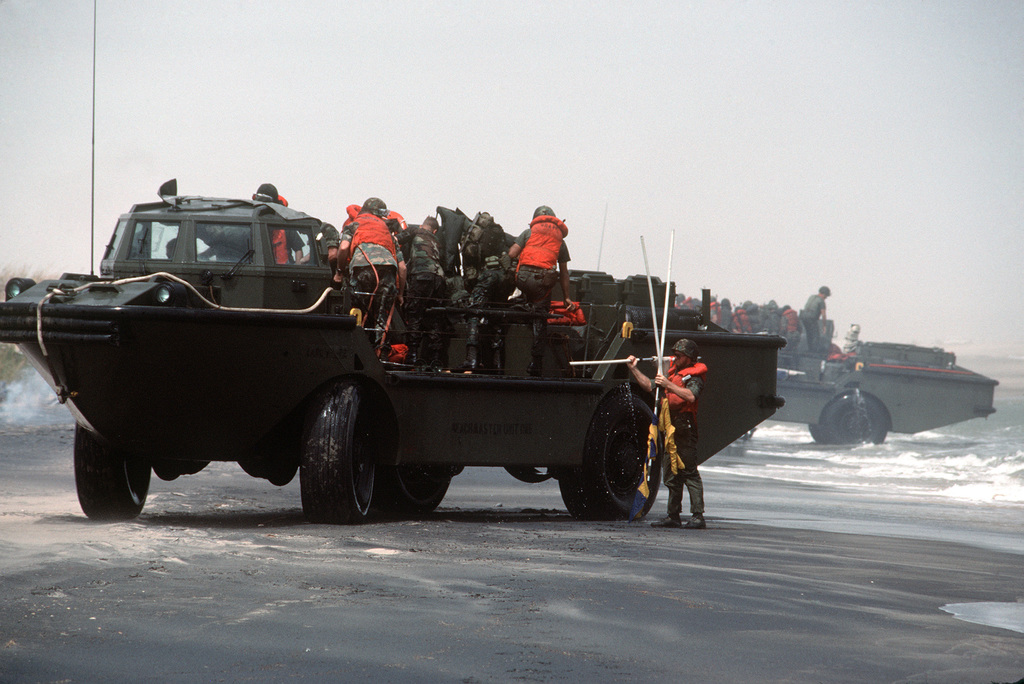 Marines Land On A Beach Aboard Larc5 Lighter Amphibious Resupply Cargo Vehicles During The 3450