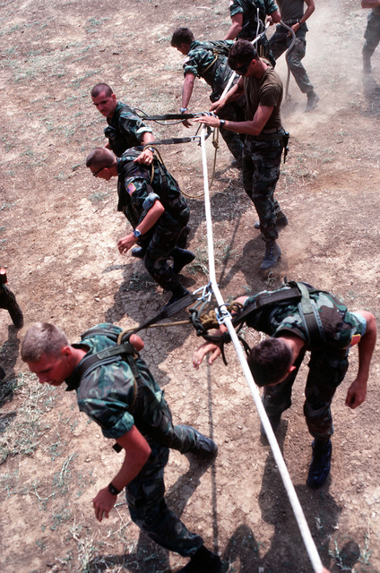 Members of the 24th Marine Amphibious Unit (MAU) prepare to be lifted ...