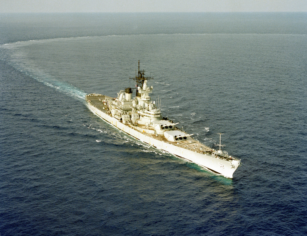 An elevated starboard bow view of the battleship USS NEW JERSEY (BB 62 ...