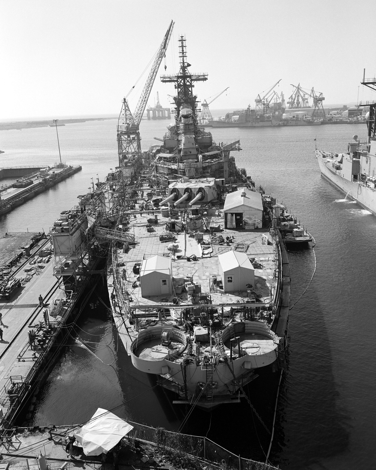 An elevated stern view of the battleship IOWA (BB 61) undergoing