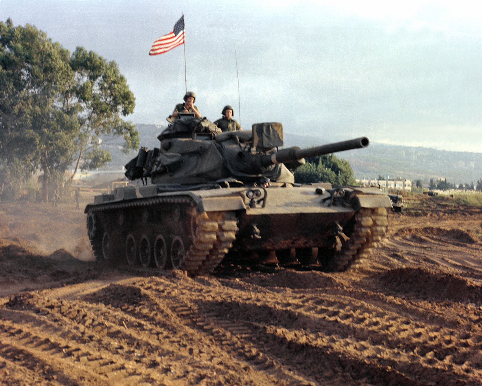 An M-60A1 main battle tank patrols the perimeter of the Marine compound ...