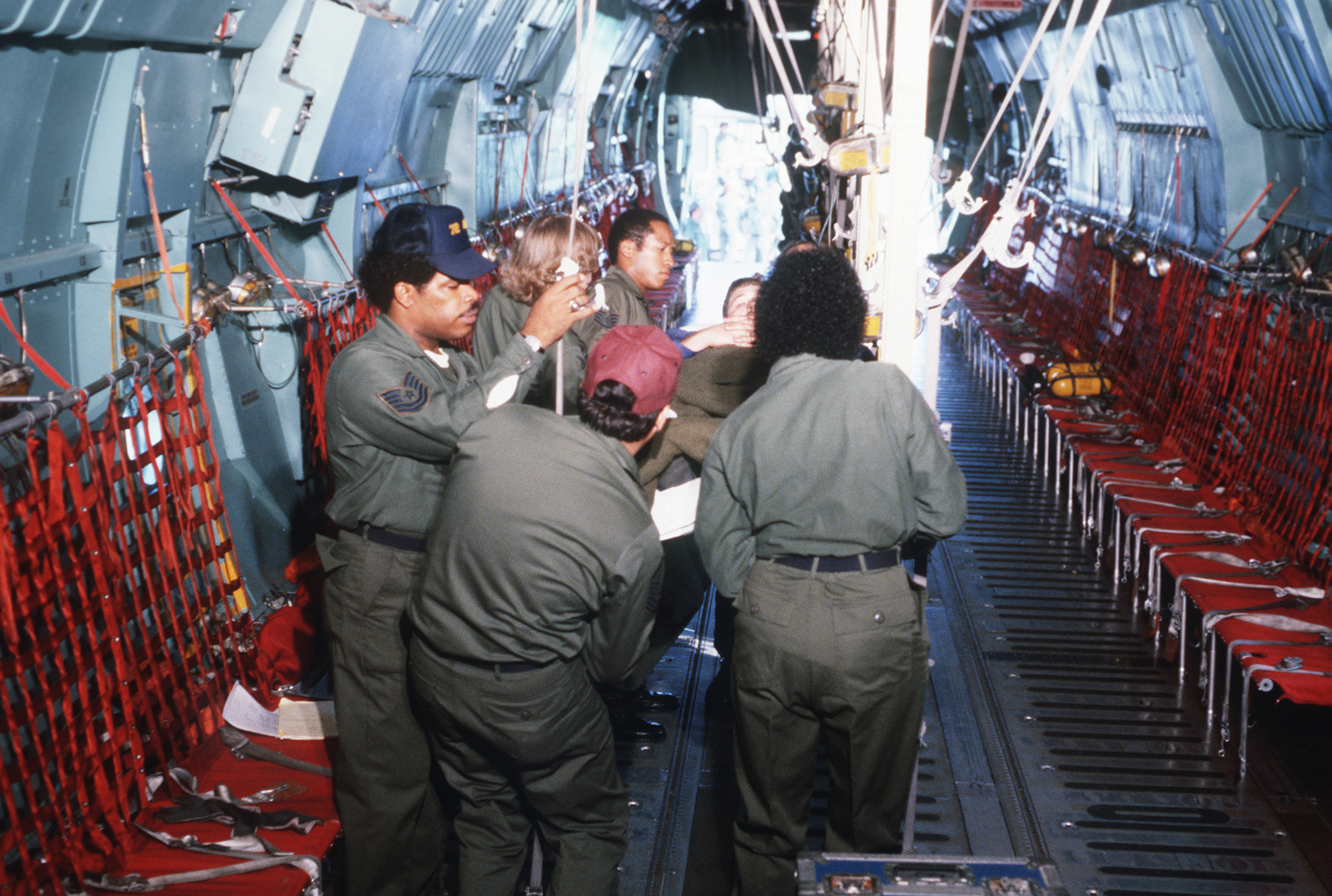 Members Of The 146th Aeromedical Evacuation Squadron Secure A Patient Aboard A C 141b Starlifter Aircraft