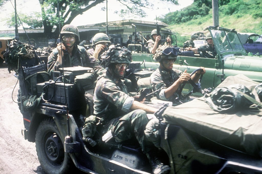 A combined Marine and Army patrol during Operation Urgent Fury. The ...