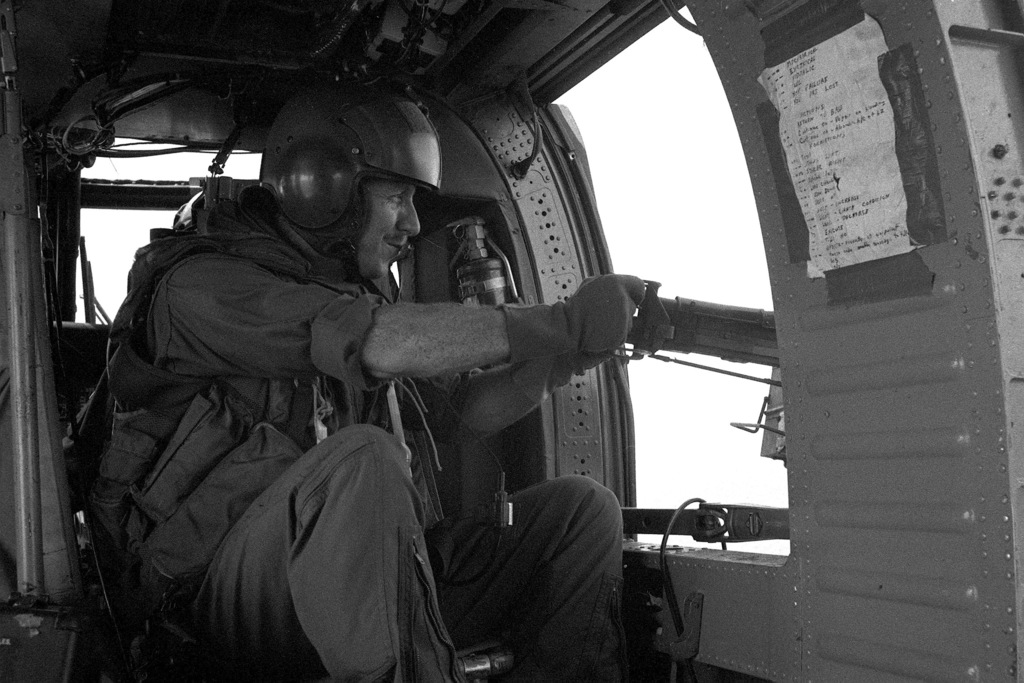 A Gunner Mans A Window Mounted M60 Machine Gun Aboard A Us Army Uh 60