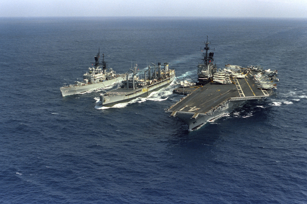 An elevated port bow view of the oiler USNS NAVASTOA (T-AO 106 ...