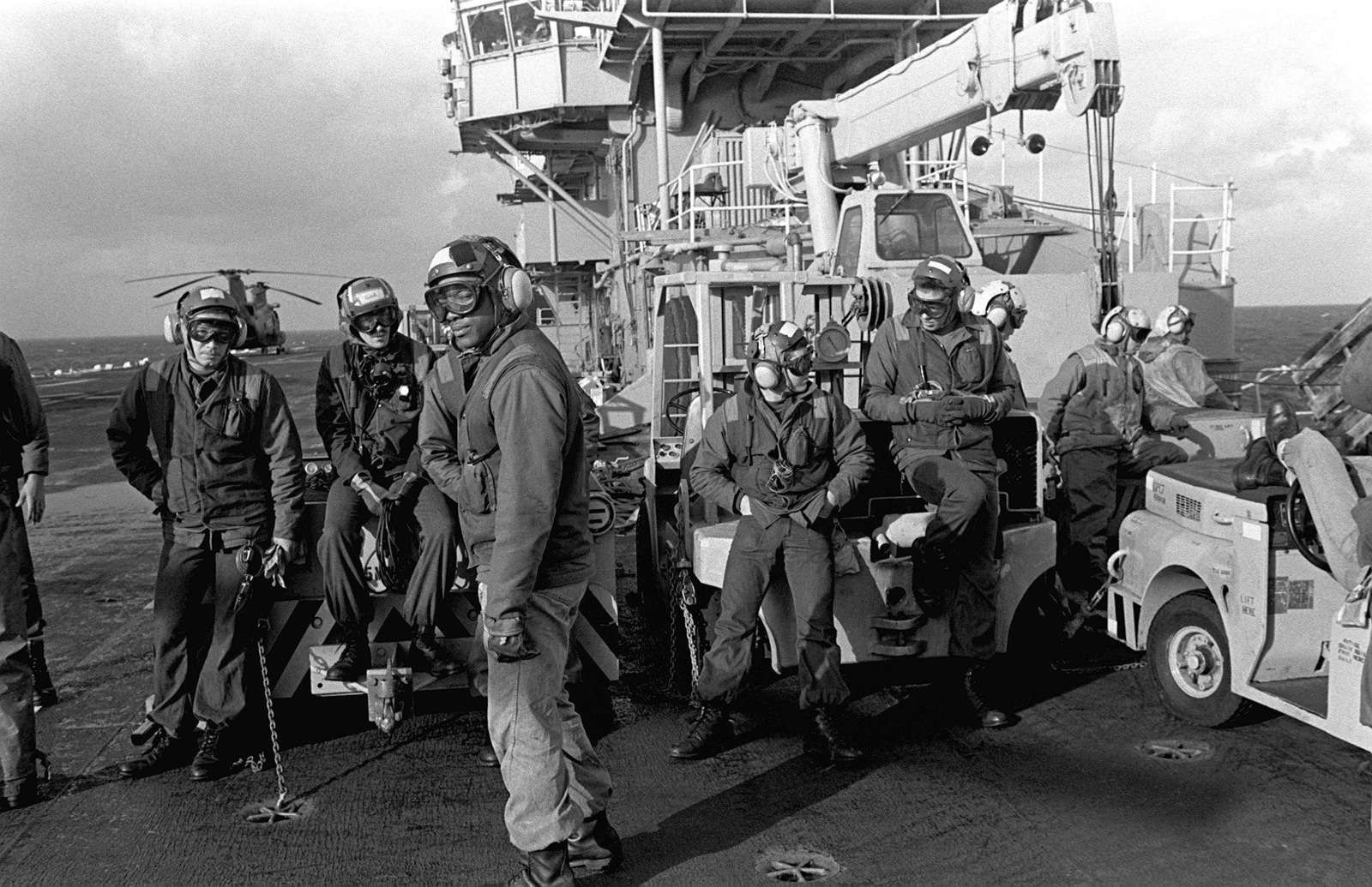 A view of several crewmen on the flight deck of the amphibious assault