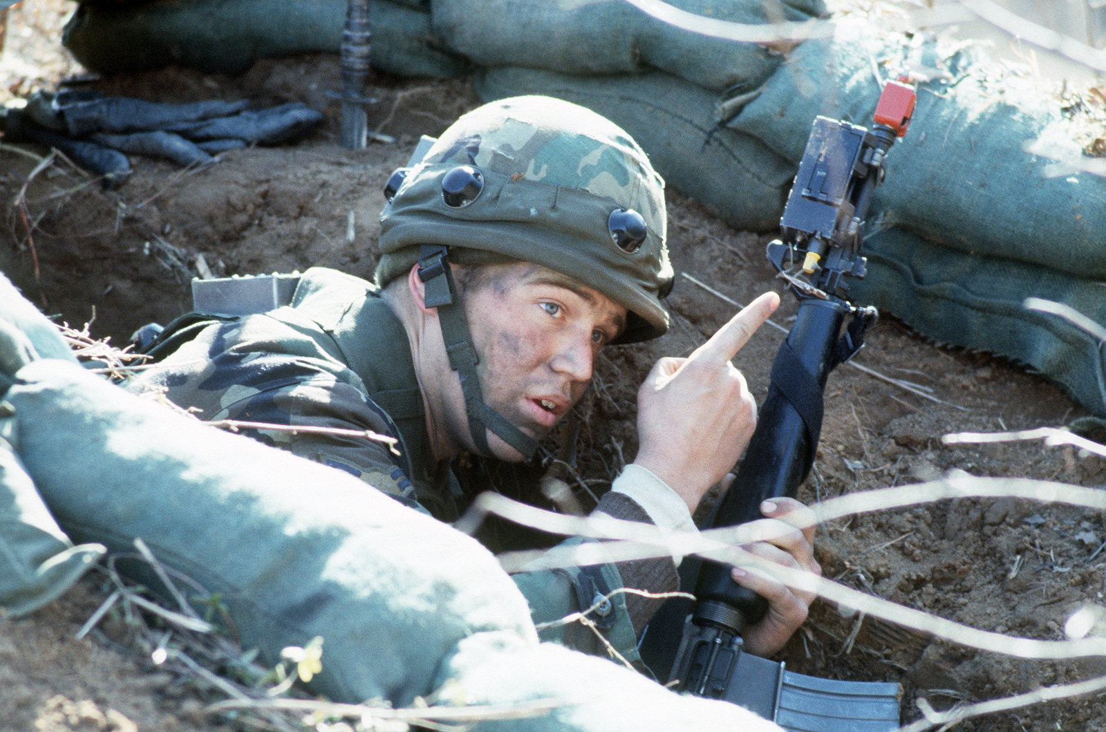 AIRMAN First Class (AMN) Brian Hoose points to the aggressor's position ...