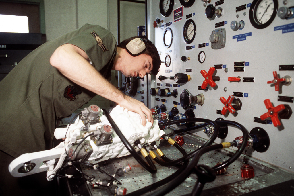 https://cdn10.picryl.com/photo/1984/02/13/a-technician-services-an-aircraft-component-on-a-test-bench-in-the-maintenance-f3e3f2-1024.jpg