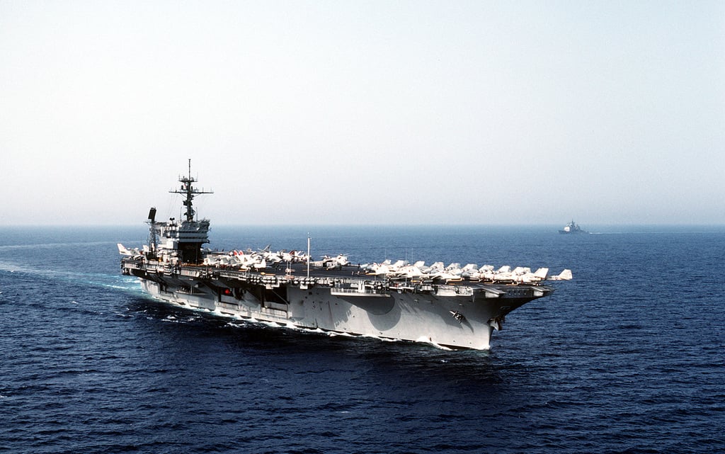 An aerial starboard bow view of the aircraft carrier USS JOHN F ...