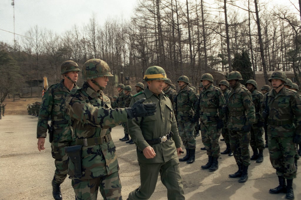 Lieutenant General Kim Dong Chun, right, commander, III Corps, Republic ...