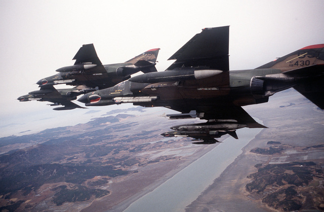 An Air-to-air Left Underside View Of Four F-4e Phantom Ii Aircraft From 