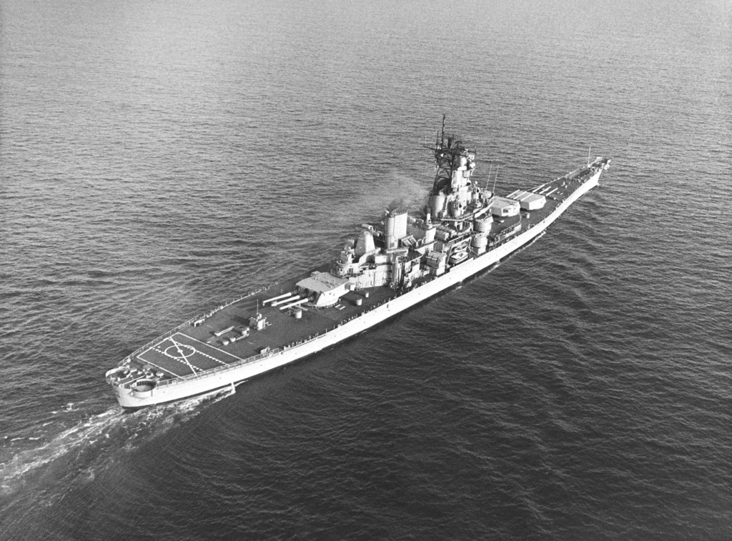 An elevated starboard quarter view of the battleship USS IOWA (BB 61 ...