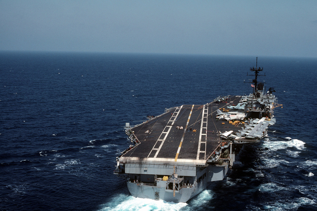 A starboard quarter view of the aircraft carrier USS SARATOGA (CV 60 ...