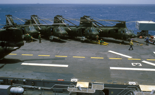 Elevated view of CH-46 Sea Knight helicopters parked on the flight deck ...