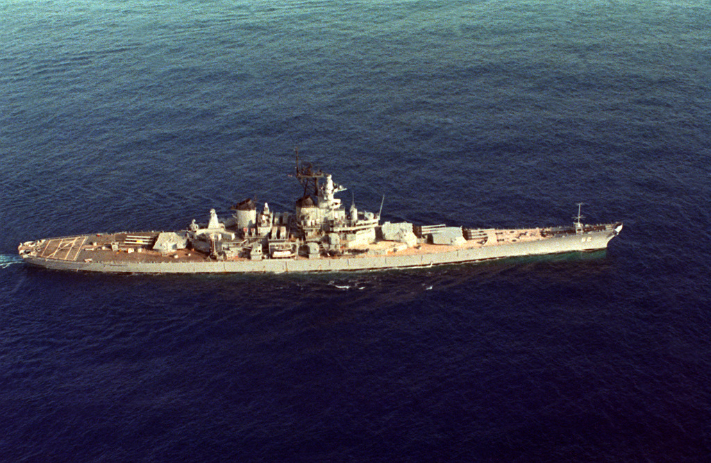 An elevated starboard beam view of the battleship USS NEW JERSEY (BB-62 ...