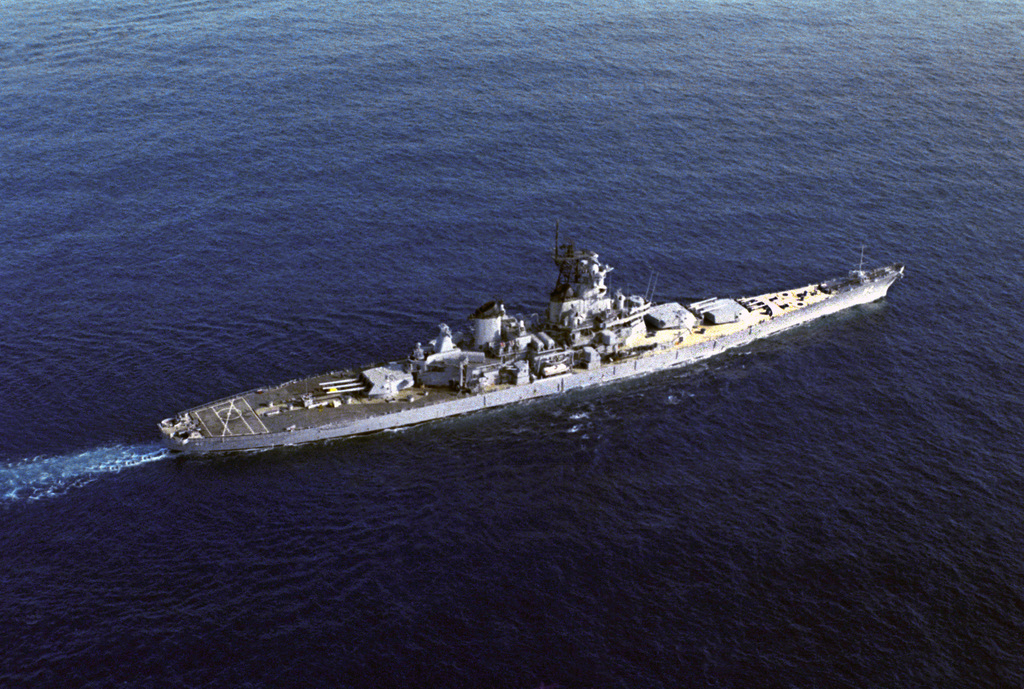 An elevated starboard view of the battleship USS NEW JERSEY (BB 62 ...