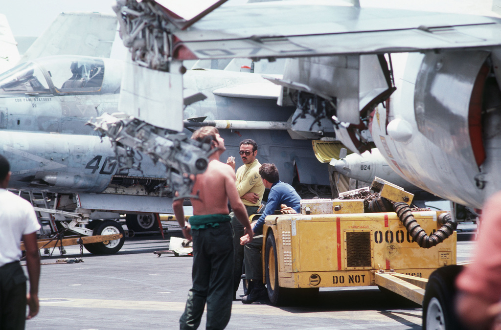 Maintenance Is Performed On A 7 Corsair Ii Aircraft Aboard The Aircraft Carrier Uss Midway Cv 