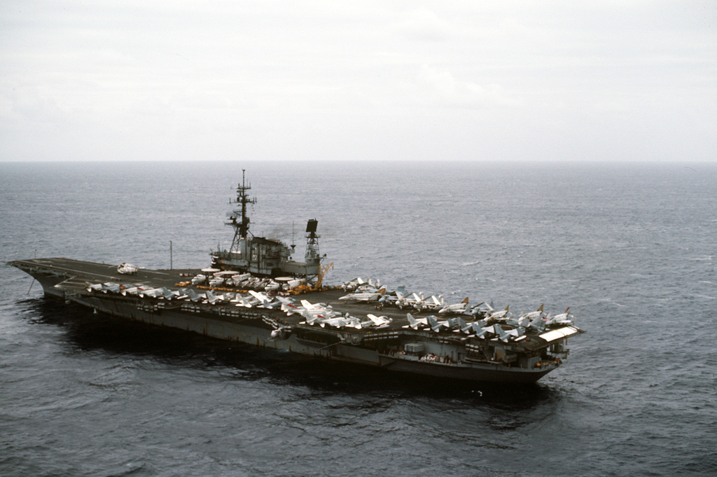 Aerial port quarter view of the aircraft carrier USS MIDWAY (CV-41 ...