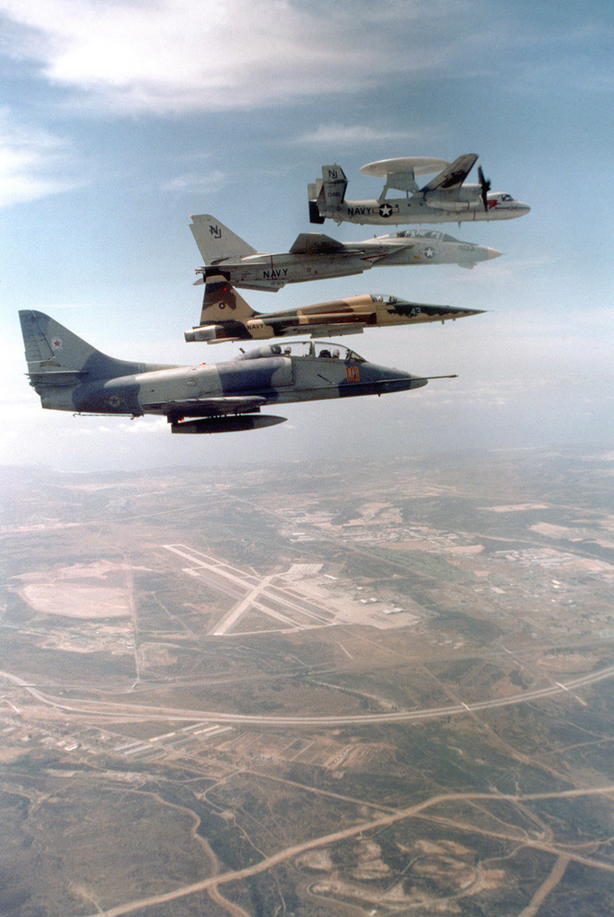 An air-to-air right side view, top to bottom, of an E-2 Hawkeye ...