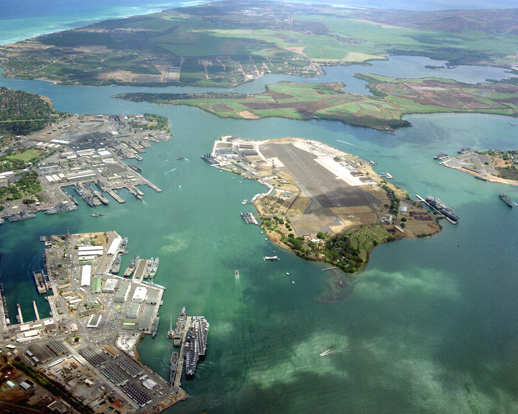 An aerial view of Pearl Harbor with the nuclear-powered aircraft ...