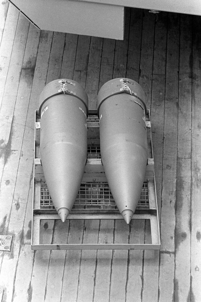 Two 16-inch projectiles sit on the deck of the battleship USS IOWA (BB ...