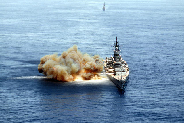 An aerial bow view of the battleship USS IOWA (BB 61) with its 15 guns ...