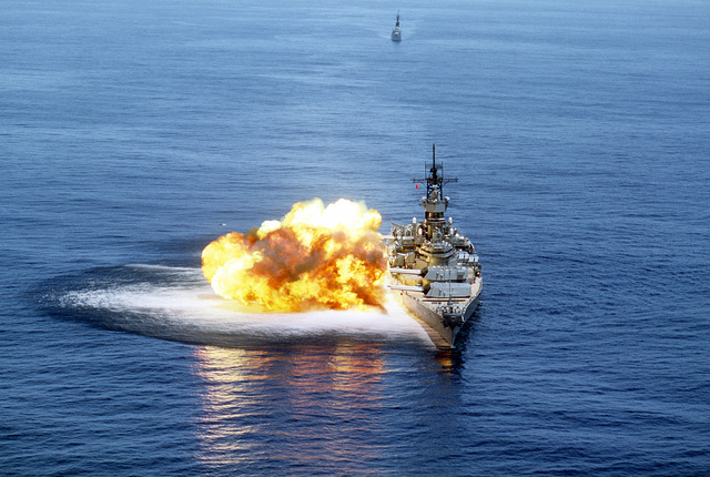 An aerial bow view of the battleship USS IOWA (BB-61) with its 15 guns ...