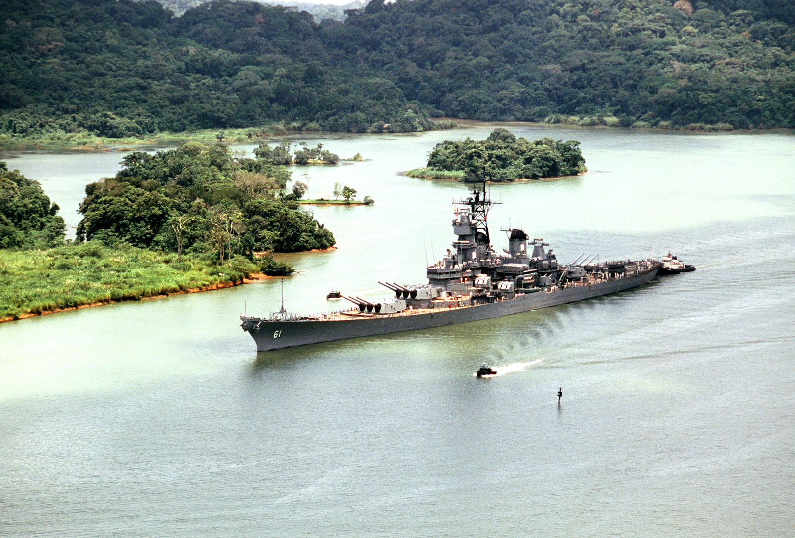 An aerial port bow view of the battleship USS IOWA (BB 61) as it ...