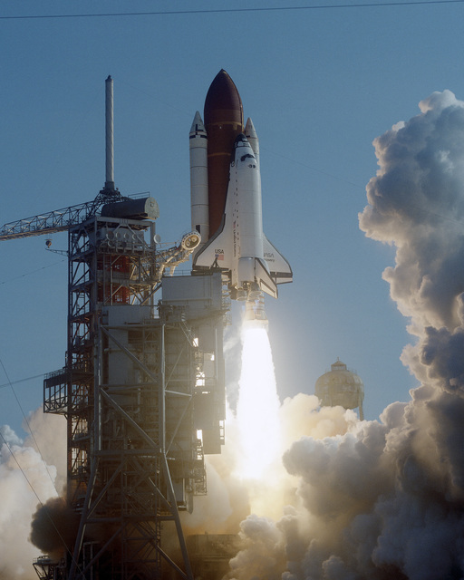 The Space Shuttle Orbiter Discovery (OV-103) lifts off on its maiden ...