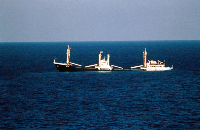 A port side view of the sinking Panamanian ship "SKY ONE". The tank