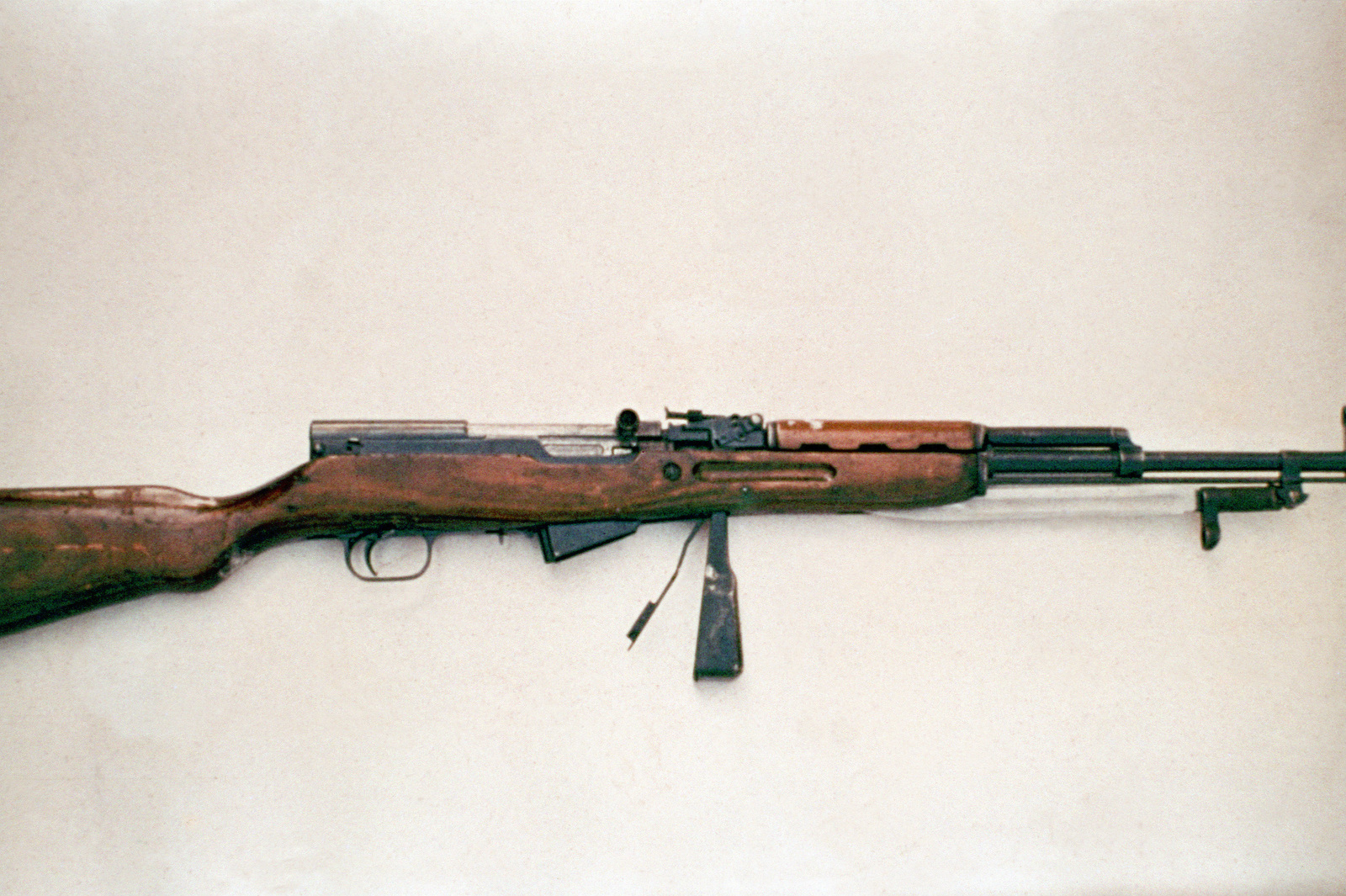 A Soviet 7.62 mm Simonov self-loading rifle (SKS) with bayonet folded ...